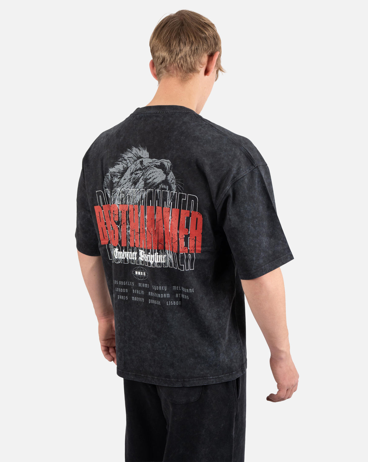 BEASTHAMMER Embrace Discipline oversized tee in faded black, worn back view with the BEASTHAMMER back print