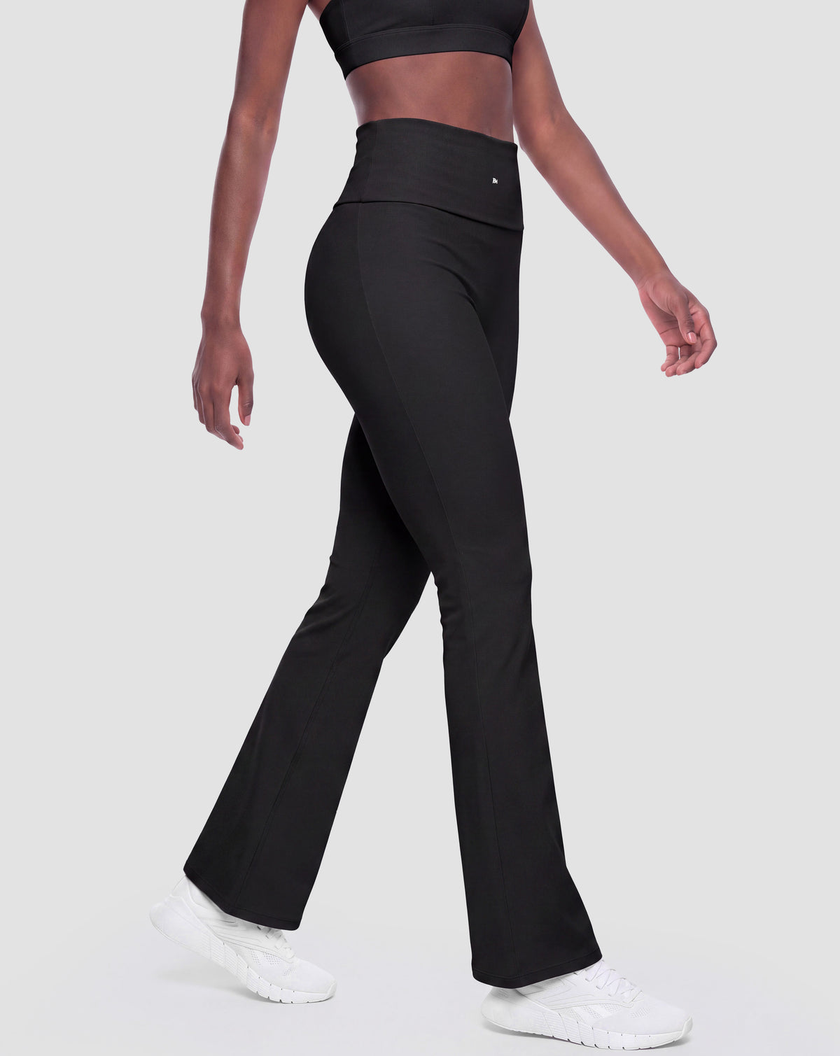 BEASTHAMMER Flow flared leggings in black, worn front view with logo