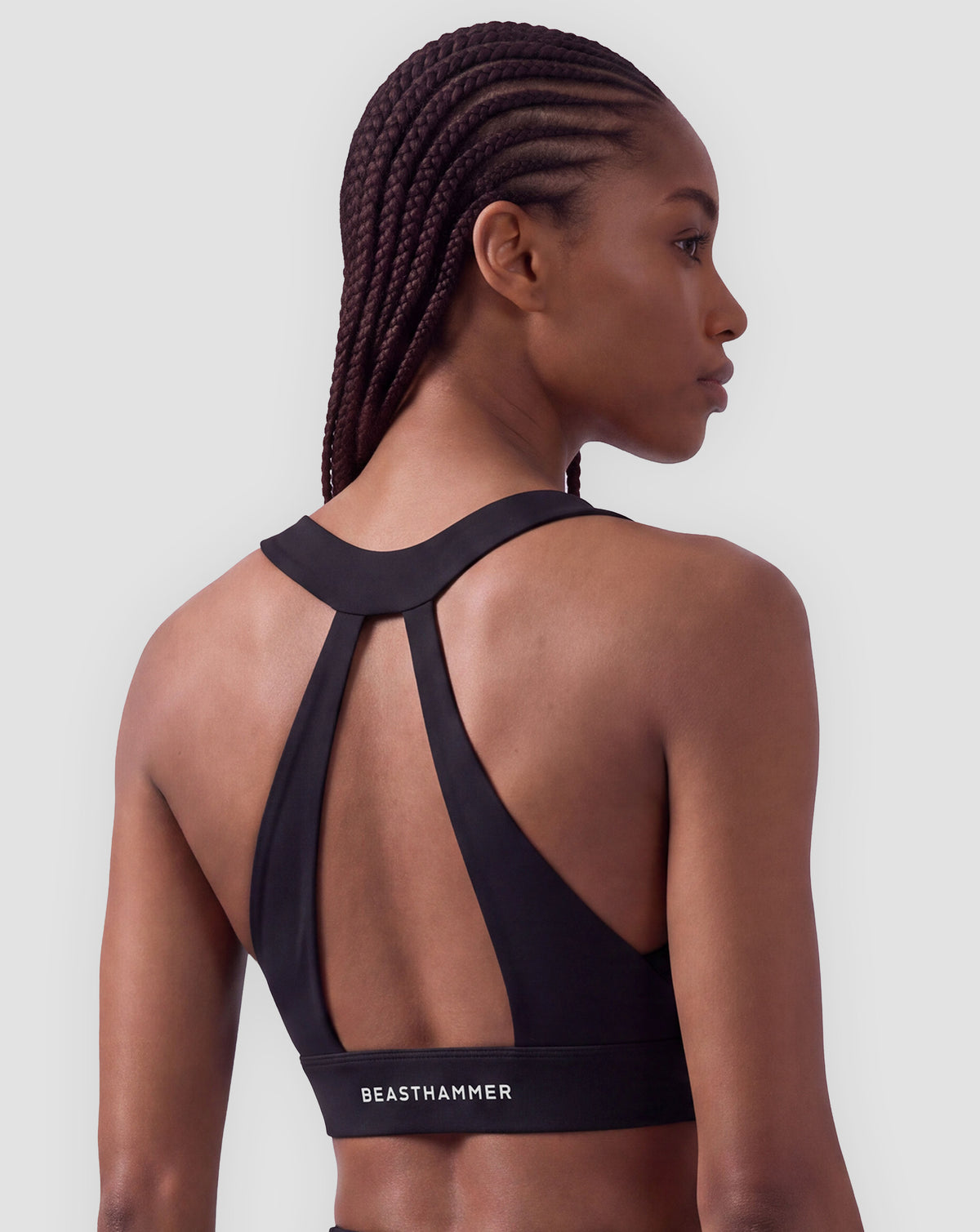 BEASTHAMMER Flow halter bra in black, worn back view