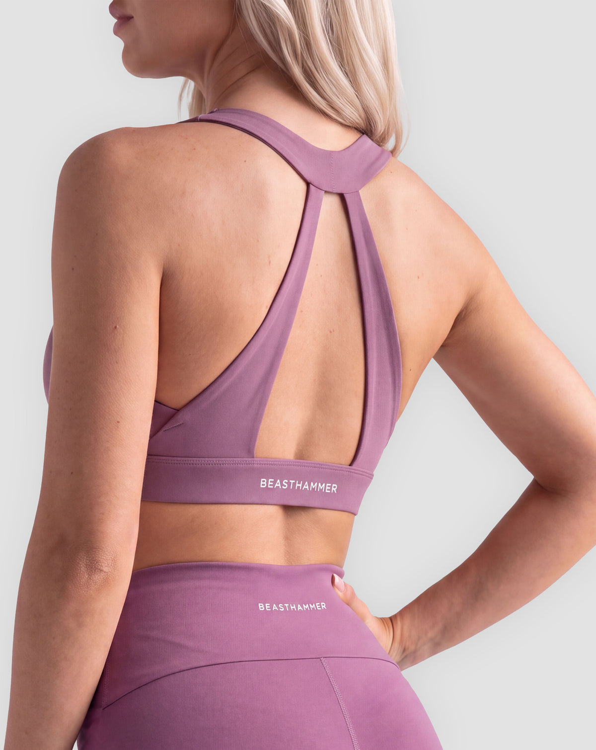 BEASTHAMMER Flow halter bra in plum purple, worn back view