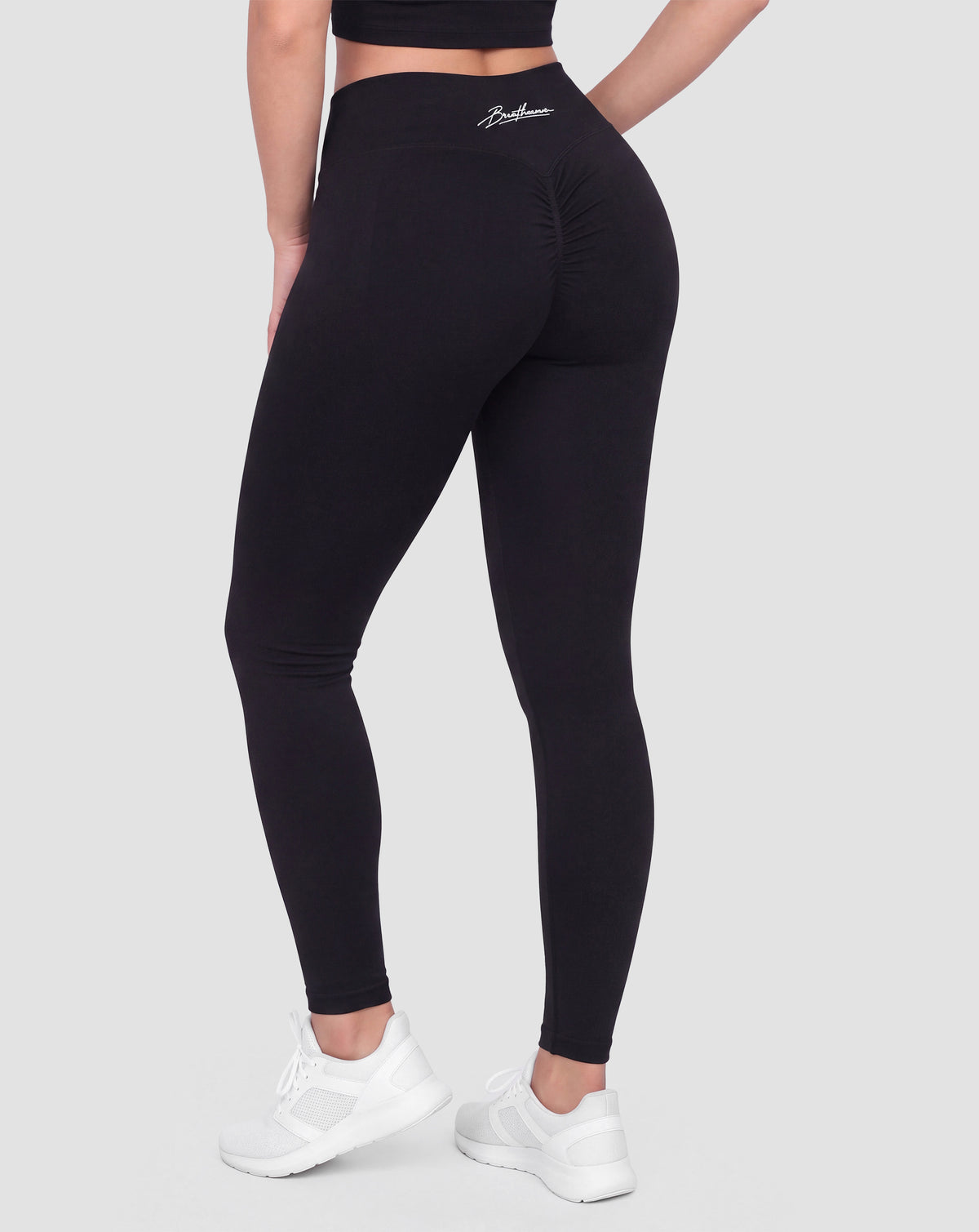 BEASTHAMMER Signature scrunch leggings in black, worn back view showing the scrunch seam and the high-rise waistband