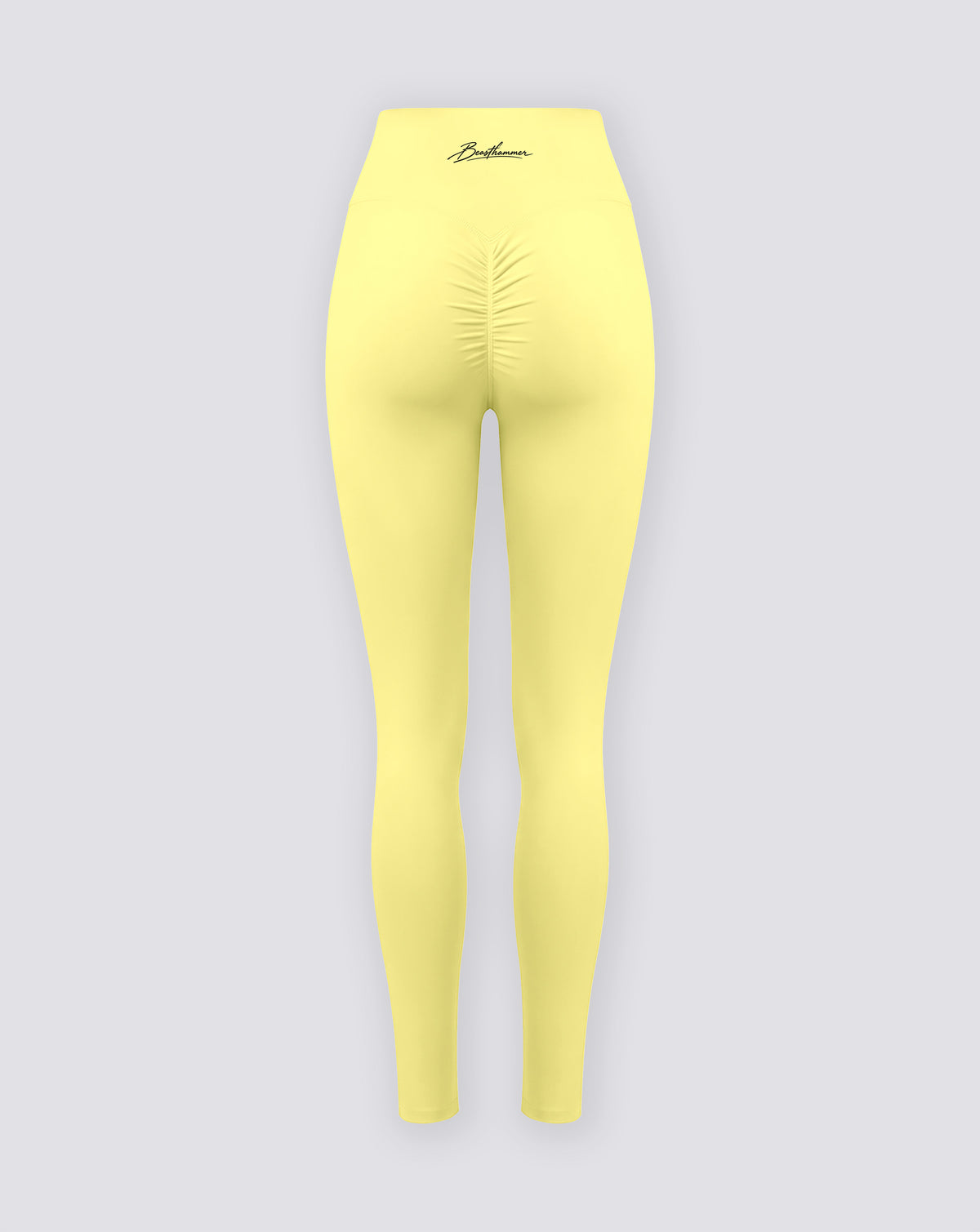 BEASTHAMMER Signature scrunch leggings in butter yellow, flat back view with the scrunch seam and the handwritten Beasthammer script logo on the waistband