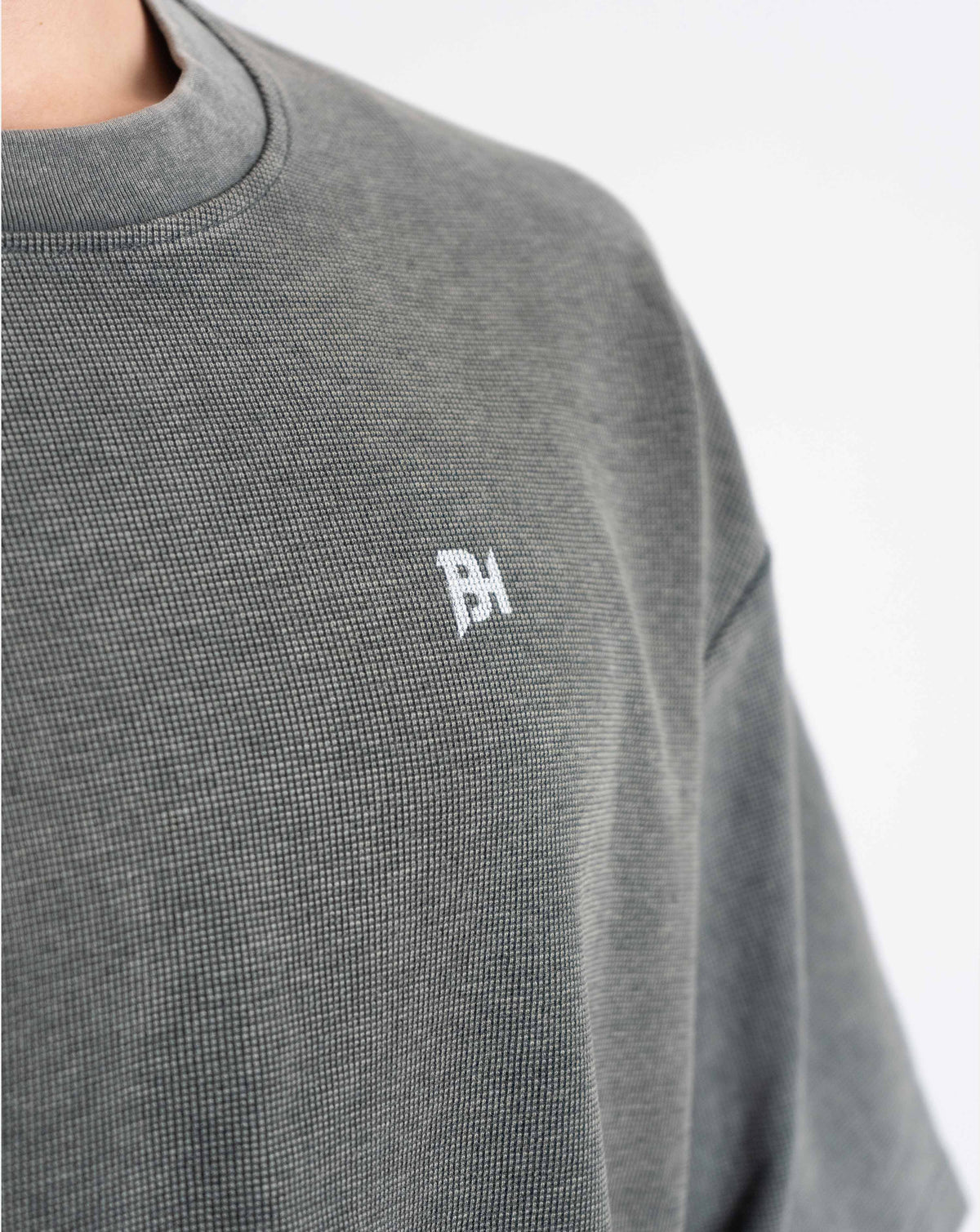 BEASTHAMMER Waffle boxy t-shirt in washed grey, close-up of the waffle texture and BH chest logo