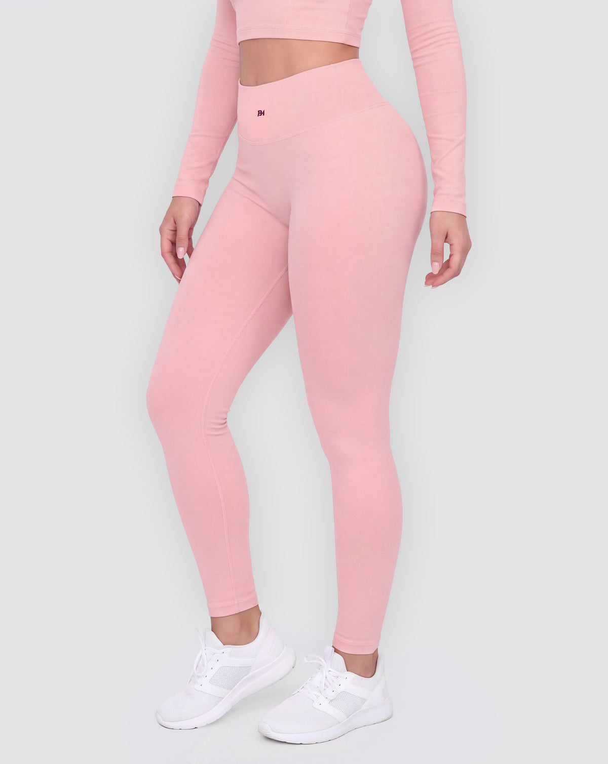 BEASTHAMMER Signature scrunch leggings in pink, worn front three-quarter view showing the high-rise waistband and ankle length