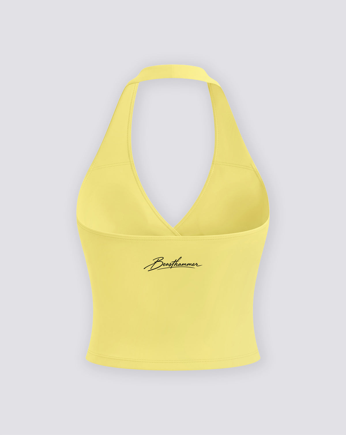 BEASTHAMMER Signature halter top in butter yellow, flat back view with the handwritten Beasthammer script logo