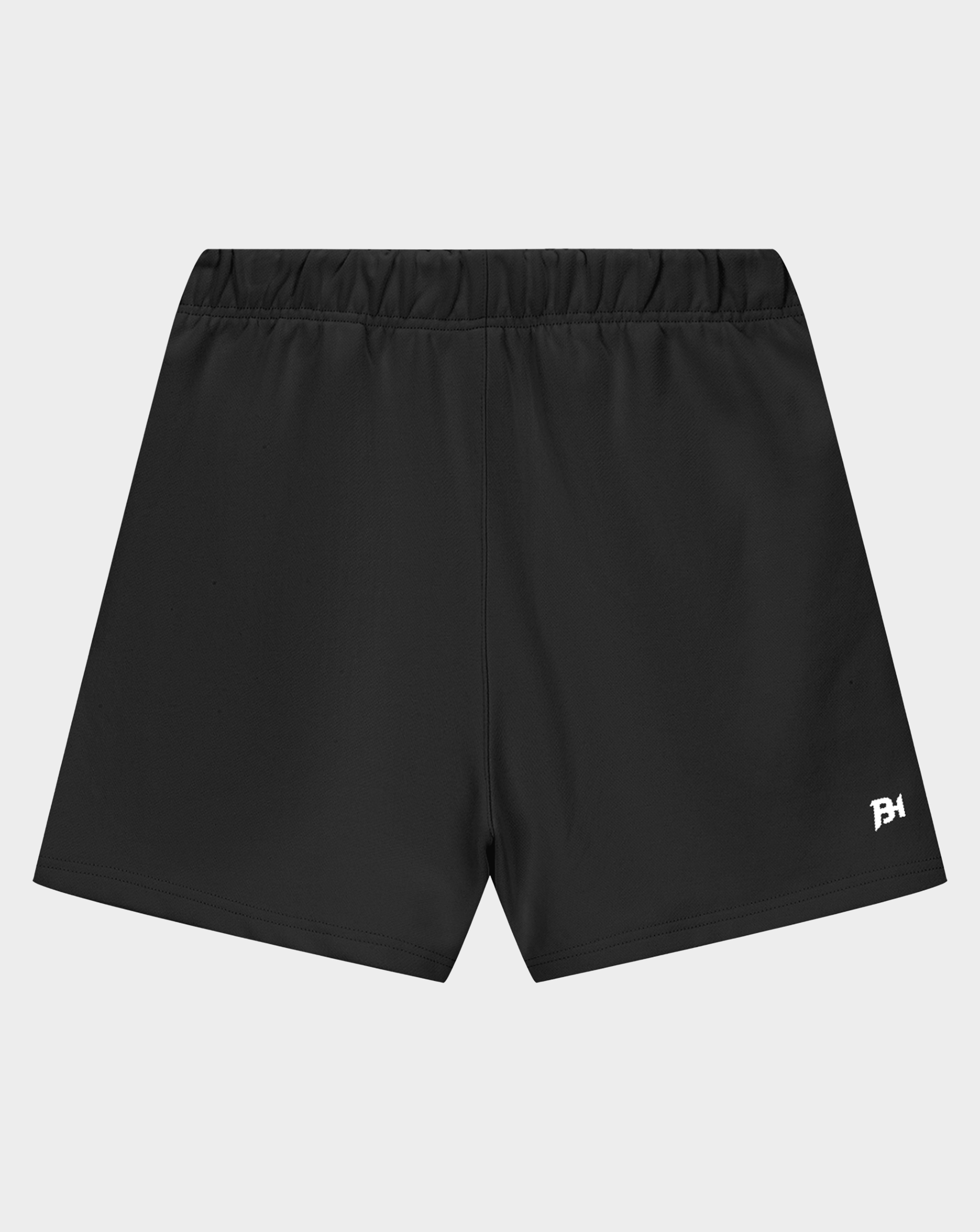 Black athletic shorts with an elastic waistband and a small white logo on the lower left hem, shown against a light gray background.