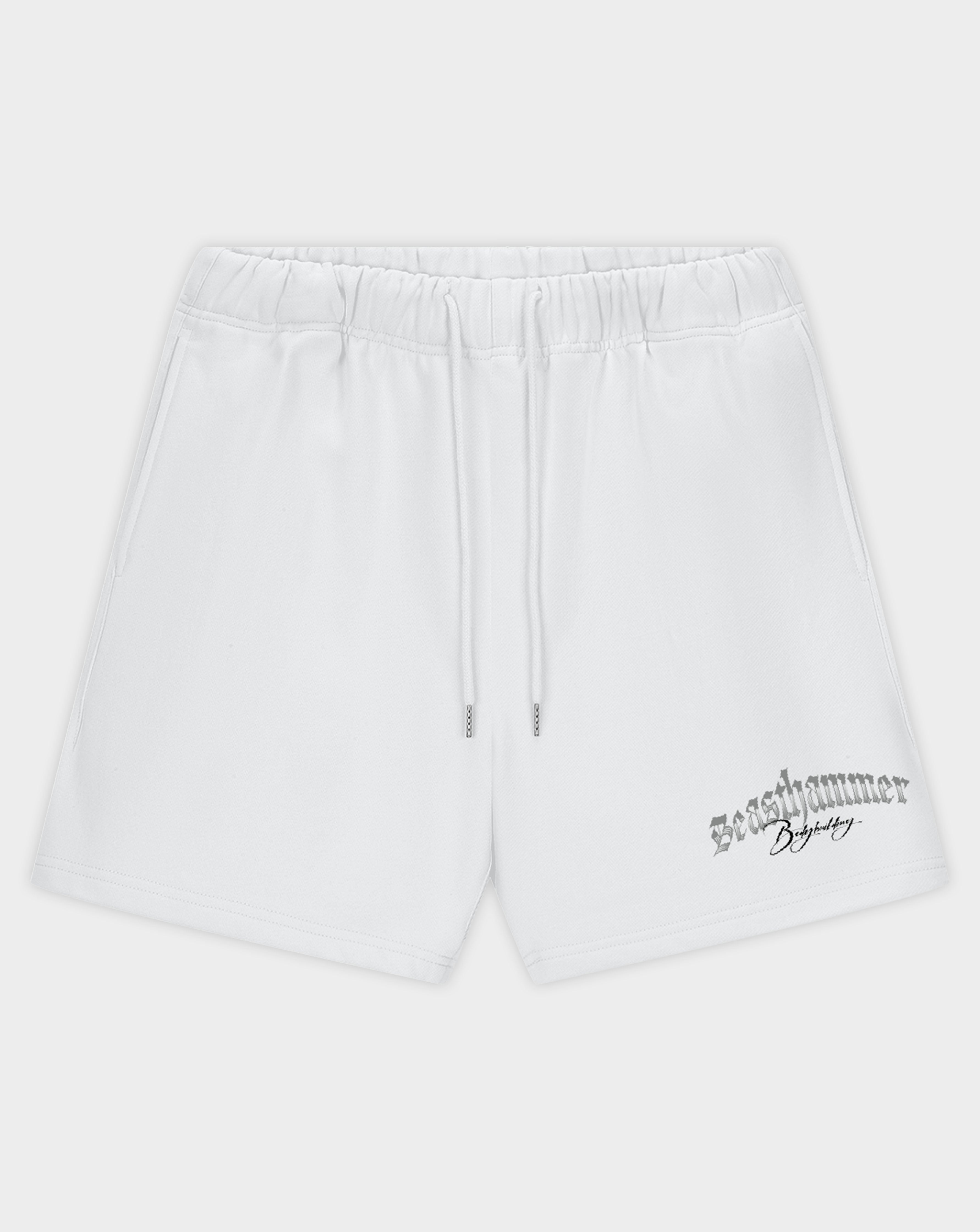 White athletic shorts with an elastic waistband, drawstring, and a black 'Revelammer' logo printed on the lower left leg, shown against a light gray background.