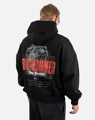 BEASTHAMMER Embrace Discipline boxy hoodie in black, worn back view with the large red BEASTHAMMER back print
