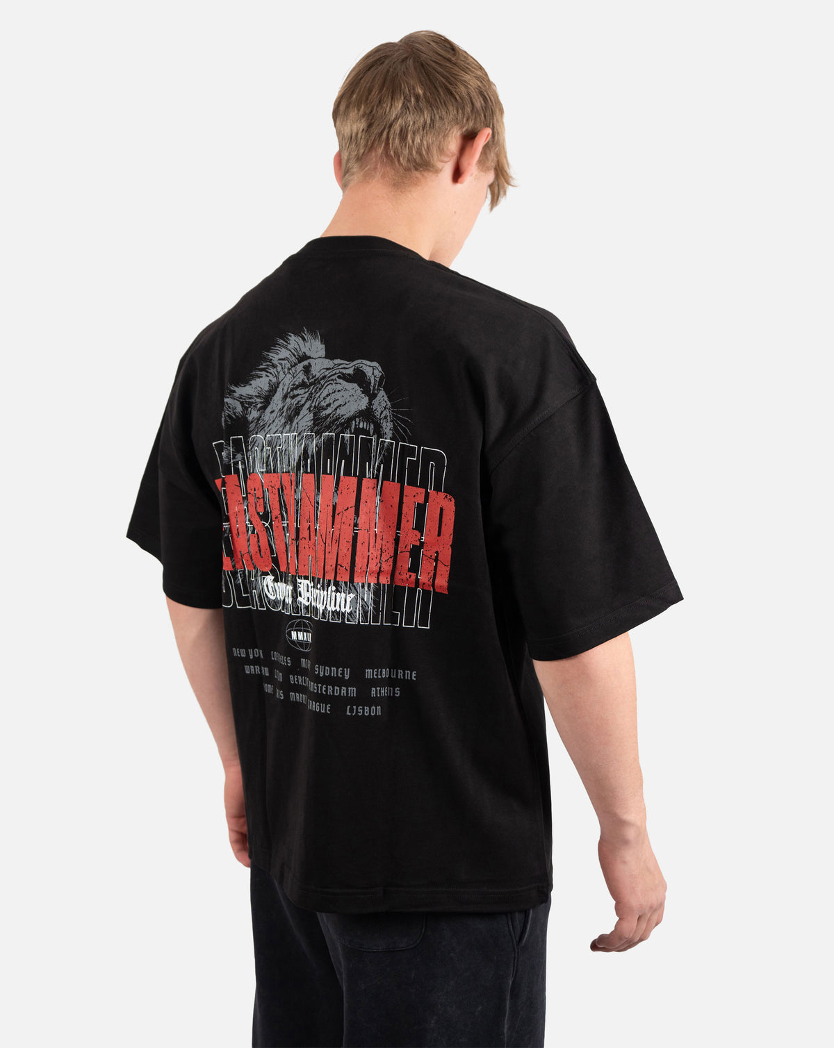 BEASTHAMMER Embrace Discipline oversized tee in black, worn back view with the large red BEASTHAMMER back print