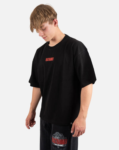 BEASTHAMMER Embrace Discipline oversized tee in black, worn front view with the small red chest logo