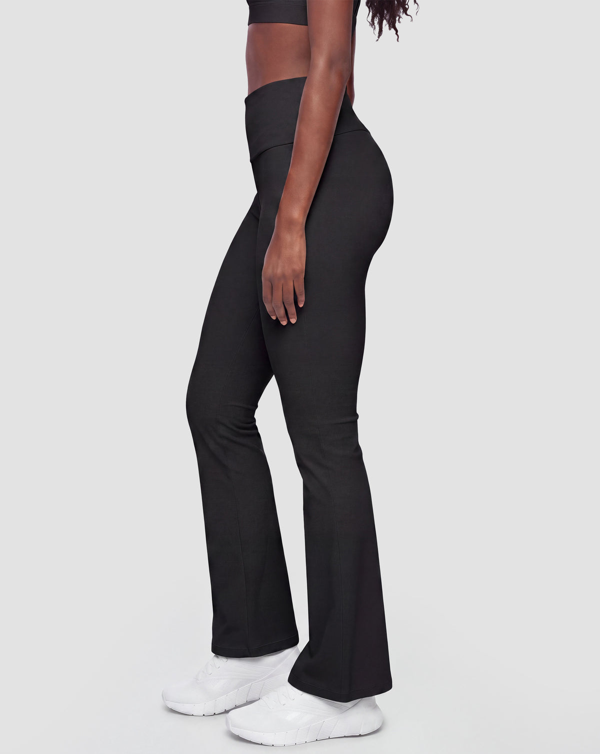 BEASTHAMMER Flow flared leggings in black, worn side view