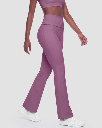 BEASTHAMMER Flow flared leggings in deep purple, worn front view with logo