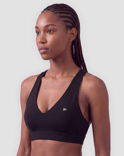 BEASTHAMMER Flow halter bra in black, worn front view