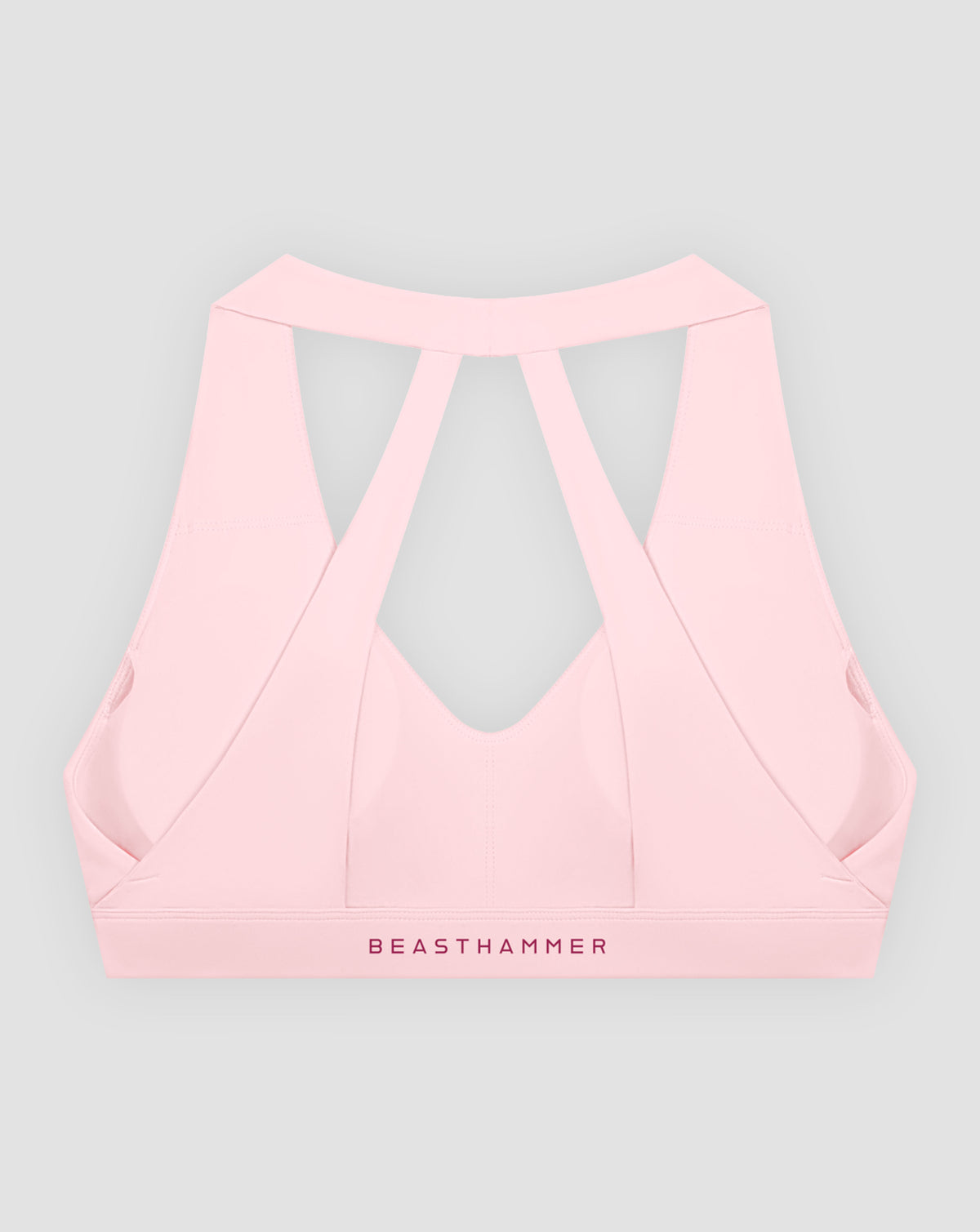 BEASTHAMMER Flow halter bra in pink, flat lay back view