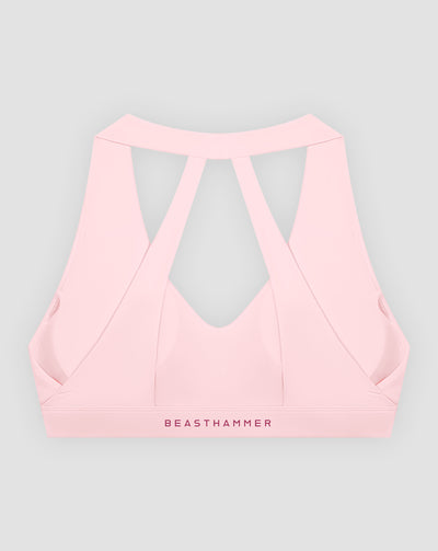 BEASTHAMMER Flow halter bra in pink, flat lay back view
