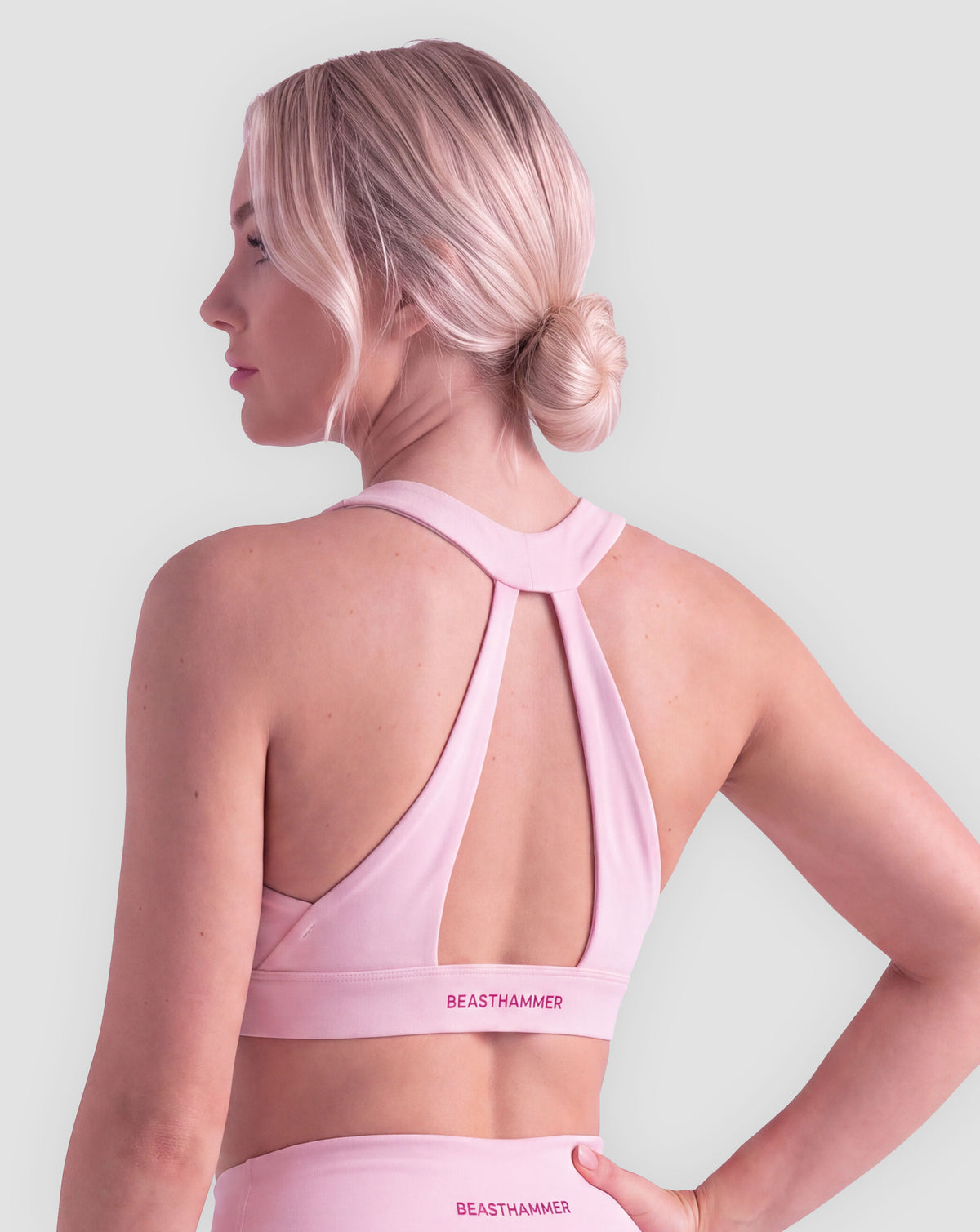BEASTHAMMER Flow halter bra in pink, worn back side view