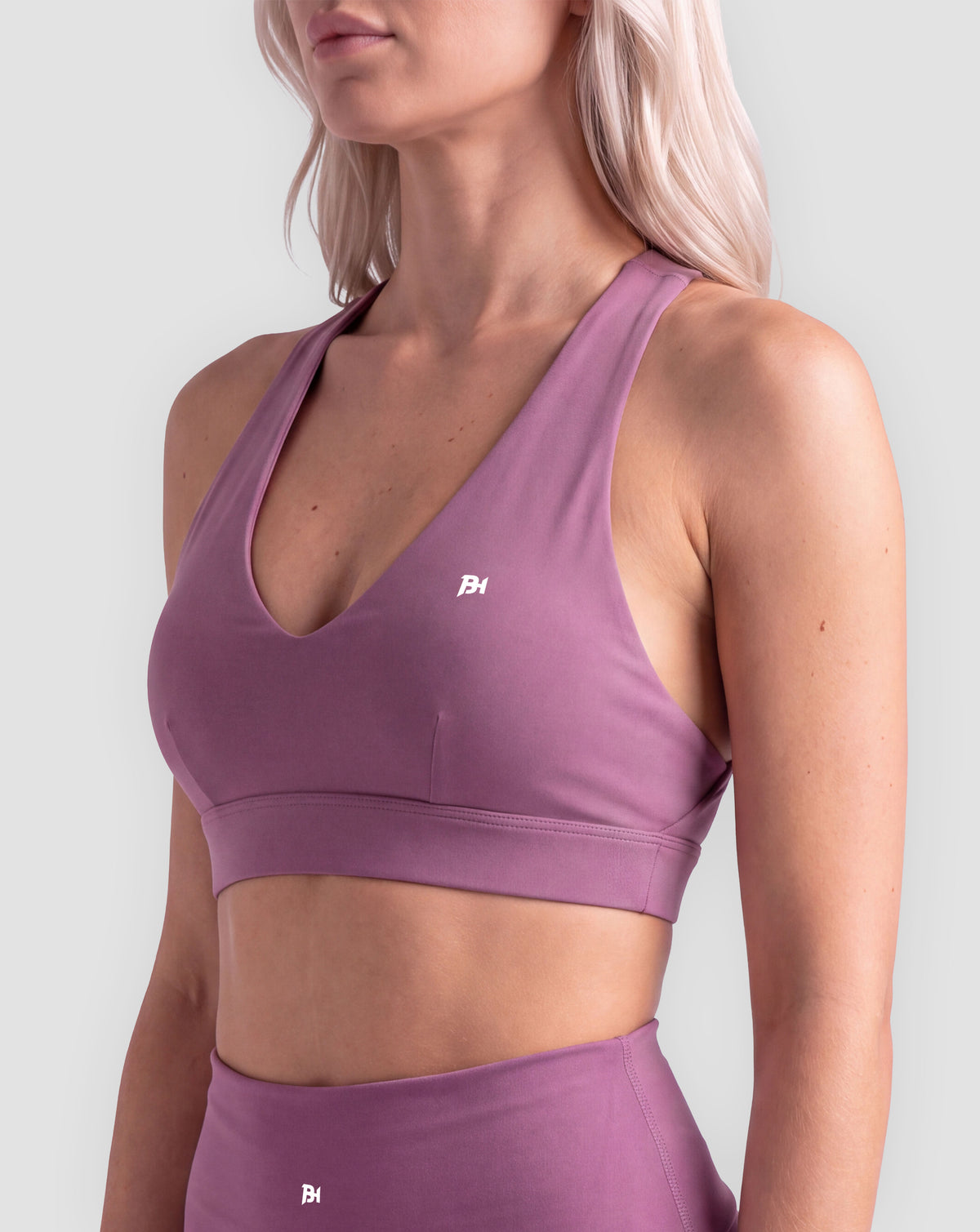 BEASTHAMMER Flow halter bra in plum purple, worn front view