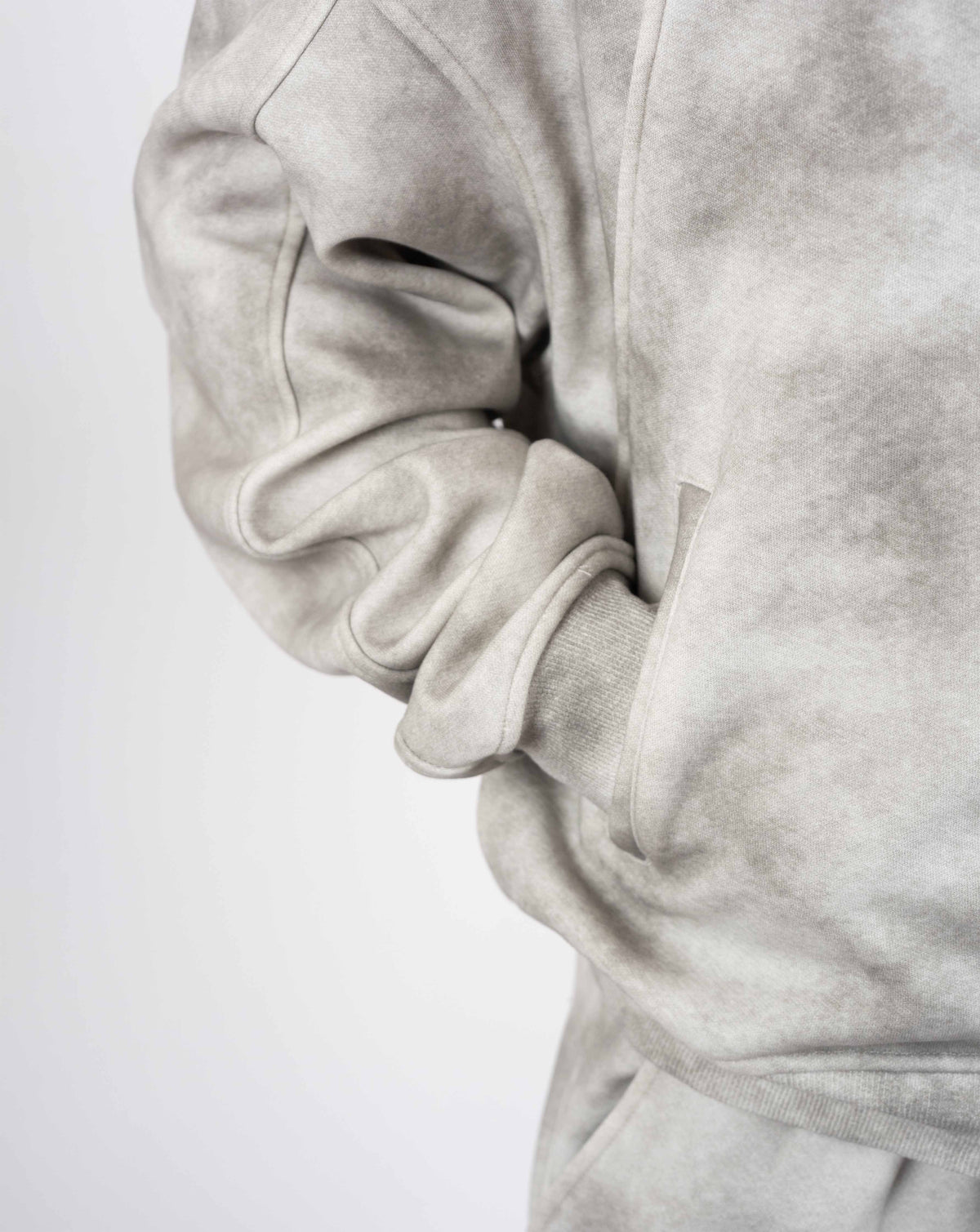BEASTHAMMER Formed by Discipline zip hoodie in faded grey, close-up of the sleeve and side pocket