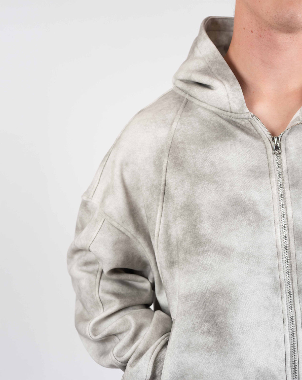 BEASTHAMMER Formed by Discipline zip hoodie in faded grey, worn three-quarter view of the hood and zip