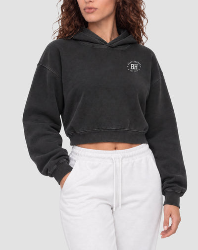 BEASTHAMMER Rest washed boxy hoodie in black, worn front view showing the boxy cropped fit and the BH badge on the chest
