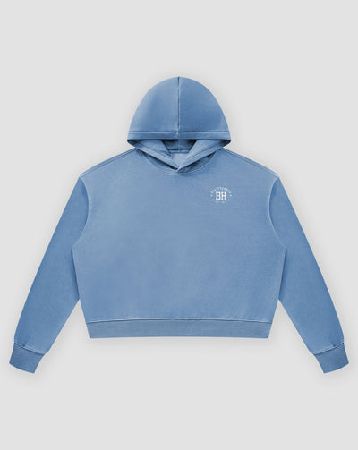 BEASTHAMMER Rest washed boxy hoodie in dusty blue, flat front view with the hood and BH chest badge