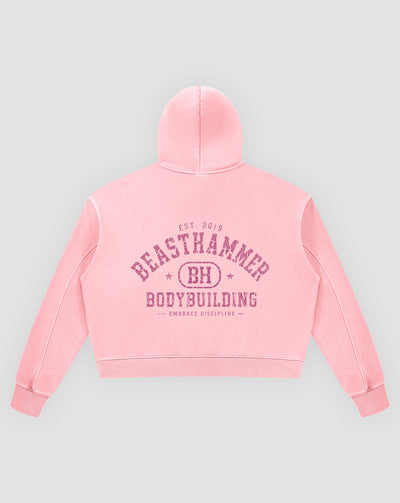 BEASTHAMMER Rest washed boxy hoodie in pink, flat back view with the collegiate BEASTHAMMER BODYBUILDING arch print