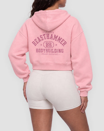 BEASTHAMMER Rest washed boxy hoodie in pink, worn back view with the collegiate BEASTHAMMER BODYBUILDING arch print