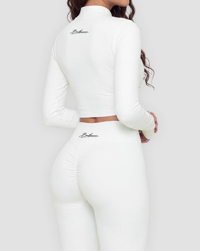 BEASTHAMMER Signature crop jacket in white, worn back three-quarter view with the handwritten Beasthammer script logo
