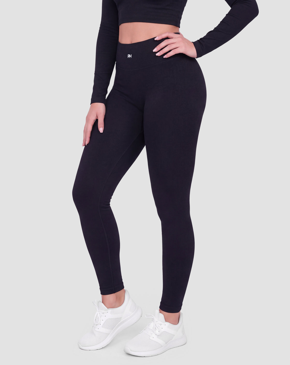 BEASTHAMMER Signature scrunch leggings in black, worn front three-quarter view showing the high-rise waistband and ankle length