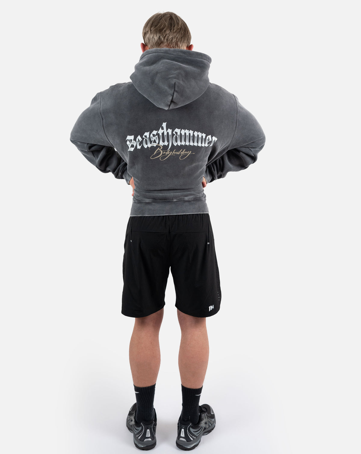 BEASTHAMMER Snow Wash oversized hoodie in washed black, full-length back view showing the oversized fit