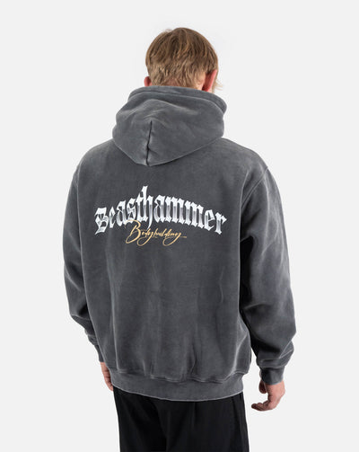 BEASTHAMMER Snow Wash oversized hoodie in washed black, worn back view with the Beasthammer Bodybuilding script print