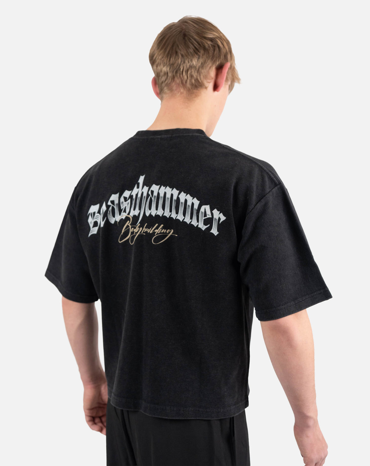 BEASTHAMMER Waffle boxy t-shirt in washed black, worn back view with the Beasthammer script print