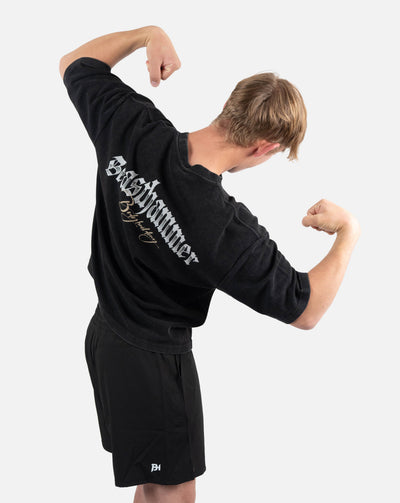 BEASTHAMMER Waffle boxy t-shirt in washed black, worn back view with arms raised