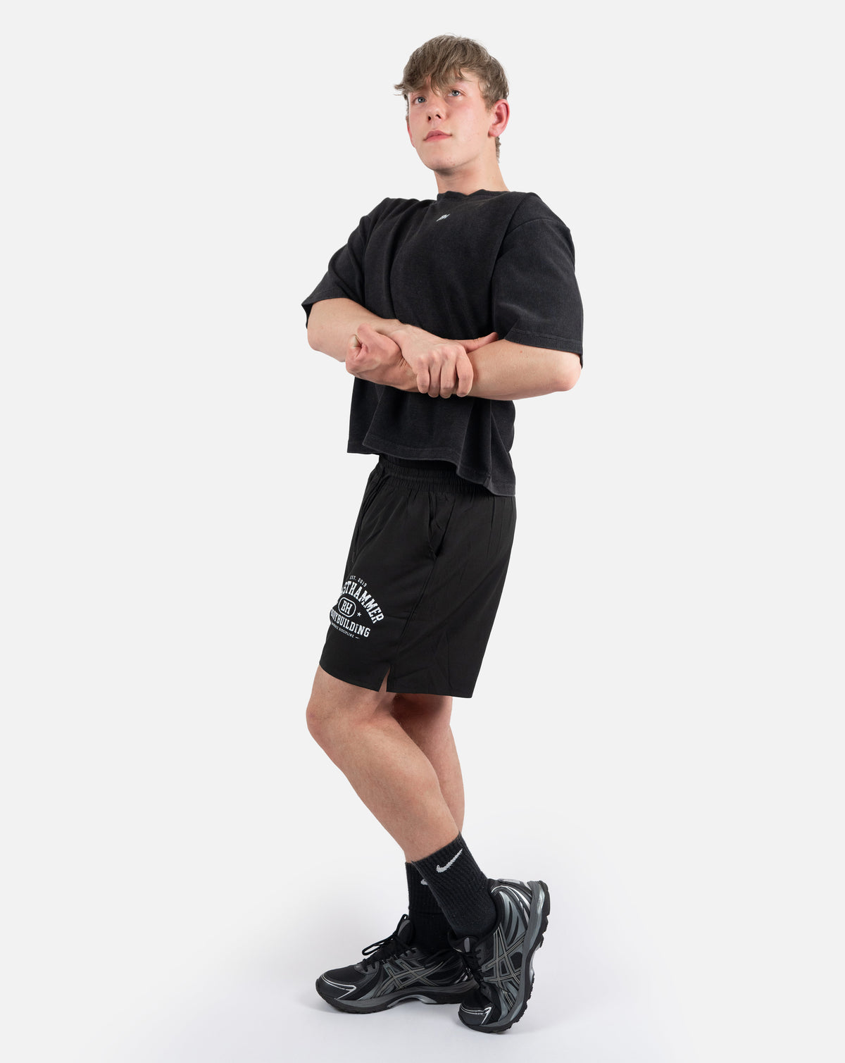 BEASTHAMMER Waffle boxy t-shirt in washed black, worn side view showing the cropped boxy fit