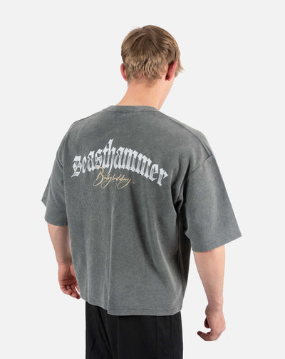 BEASTHAMMER Waffle boxy t-shirt in washed grey, worn back three-quarter view with the Beasthammer script print