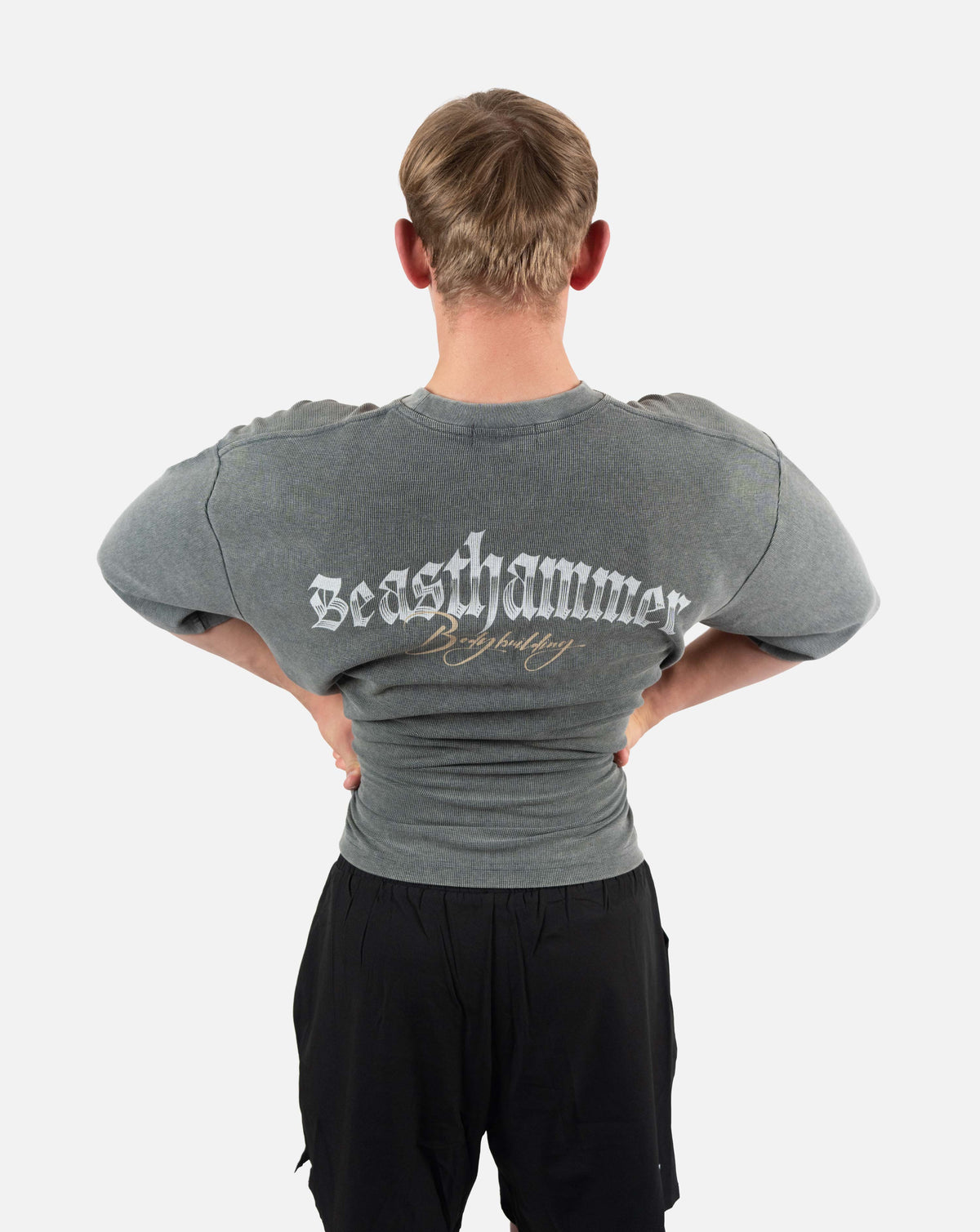 BEASTHAMMER Waffle boxy t-shirt in washed grey, worn back view with arms flexed