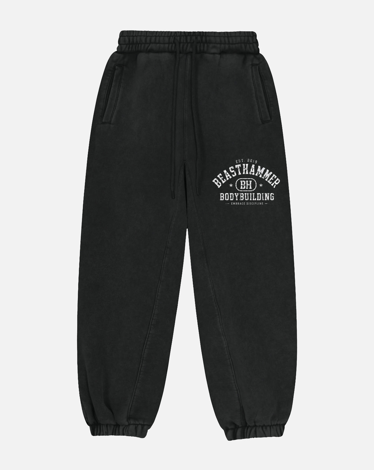 BEASTHAMMER Snow Wash cuffed joggers in black, flat front view with the arched BEASTHAMMER print on the thigh