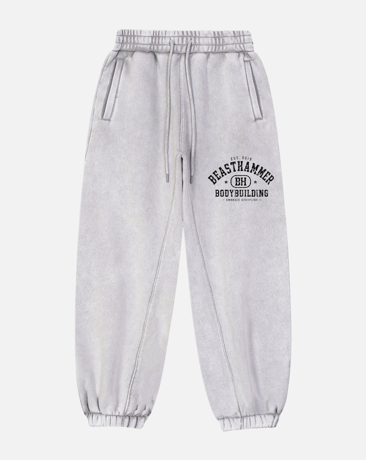 BEASTHAMMER Snow Wash cuffed joggers in grey, flat front view with the arched BEASTHAMMER print on the thigh