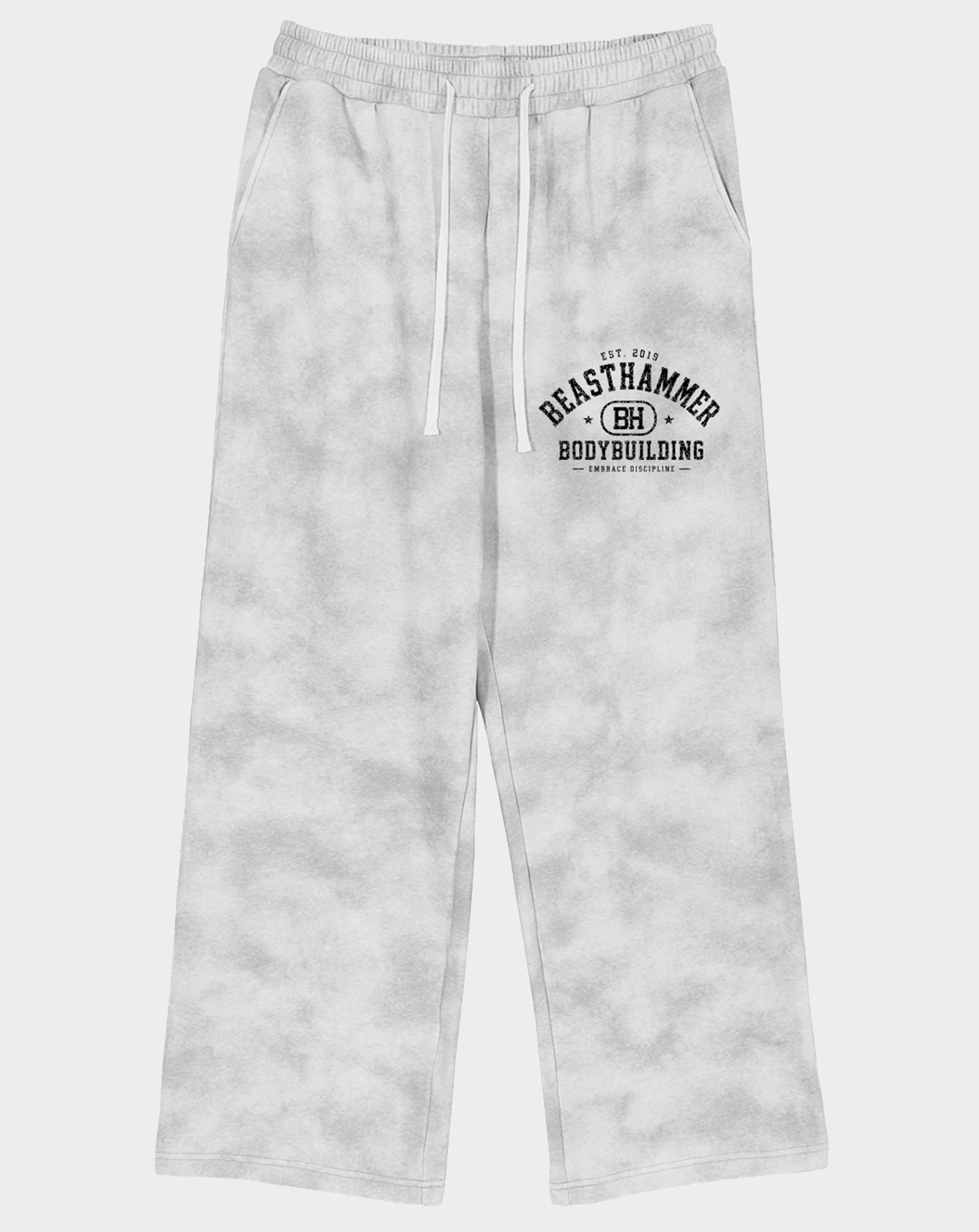 BEASTHAMMER Formed by Discipline baggy joggers in faded grey, front view with logo on thigh