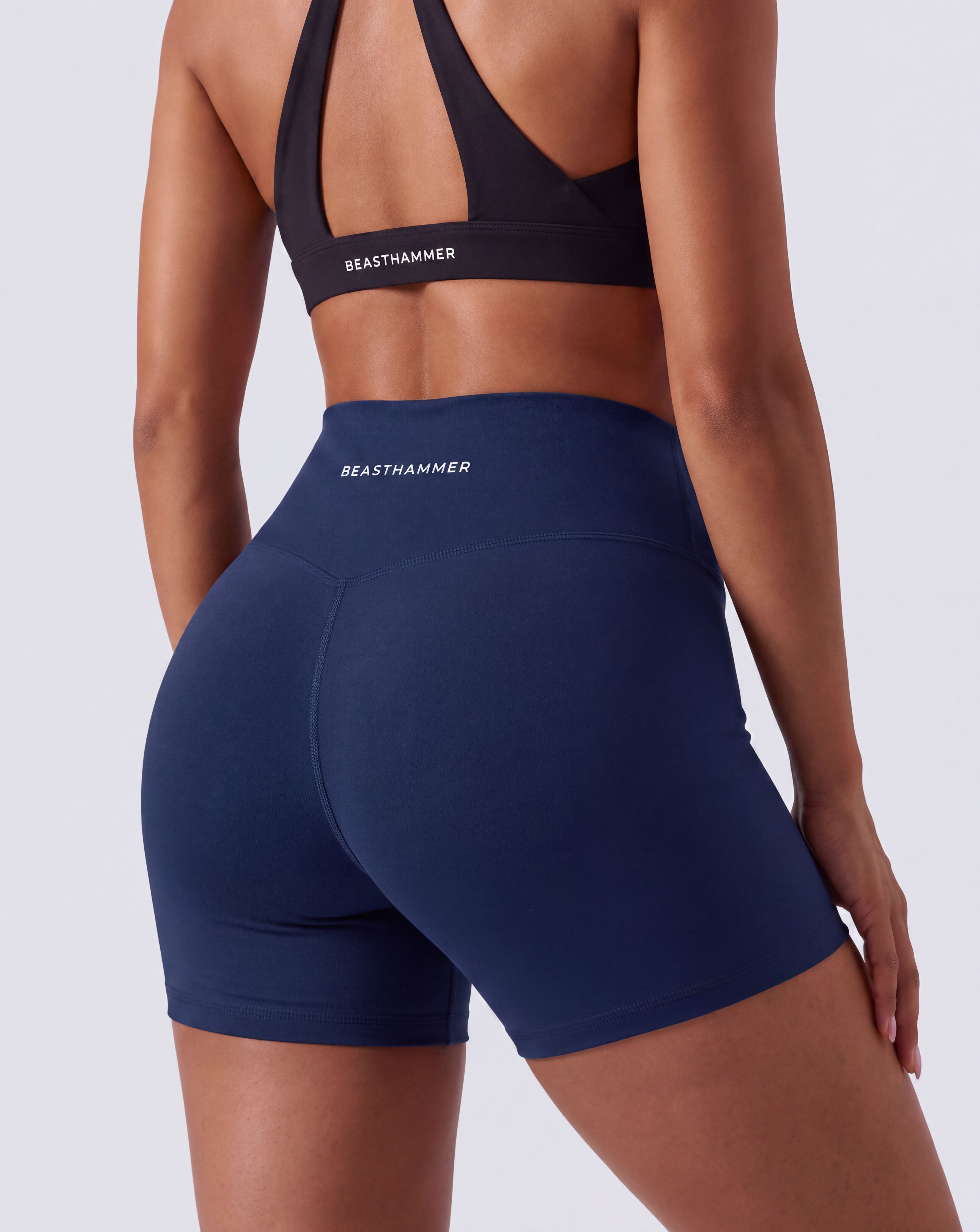 BEASTHAMMER Form high rise shorts in dark blue, worn back view