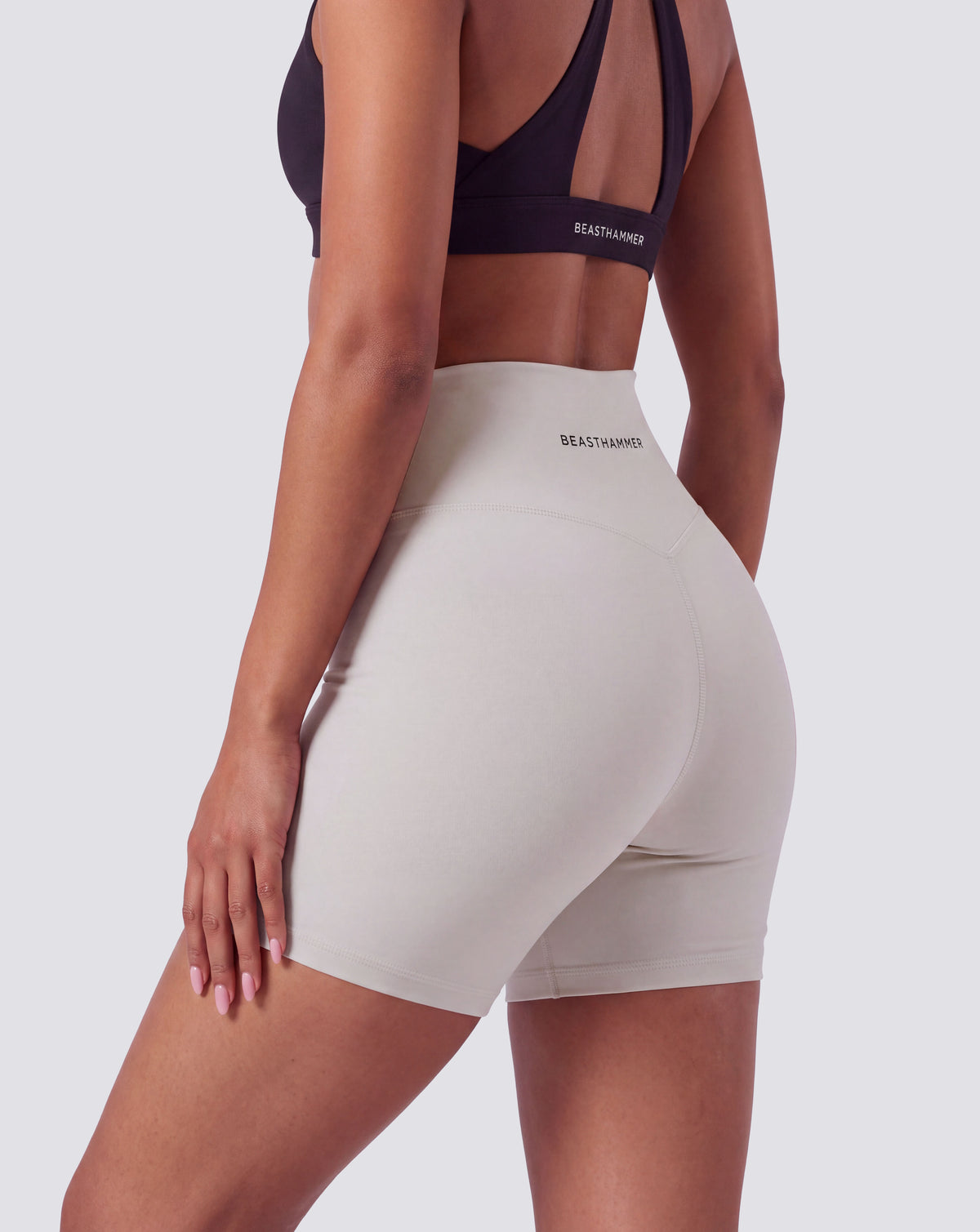 BEASTHAMMER Form high rise shorts in beige, worn back view