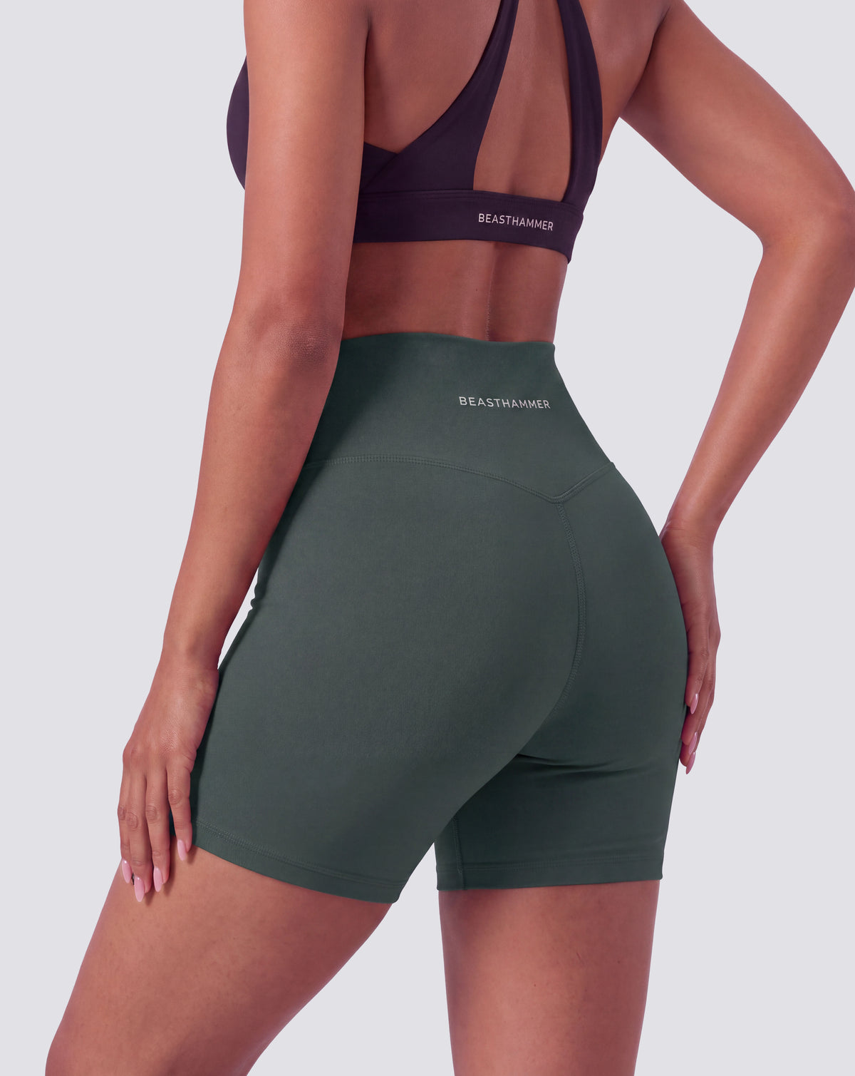BEASTHAMMER Form high rise shorts in green, worn back view