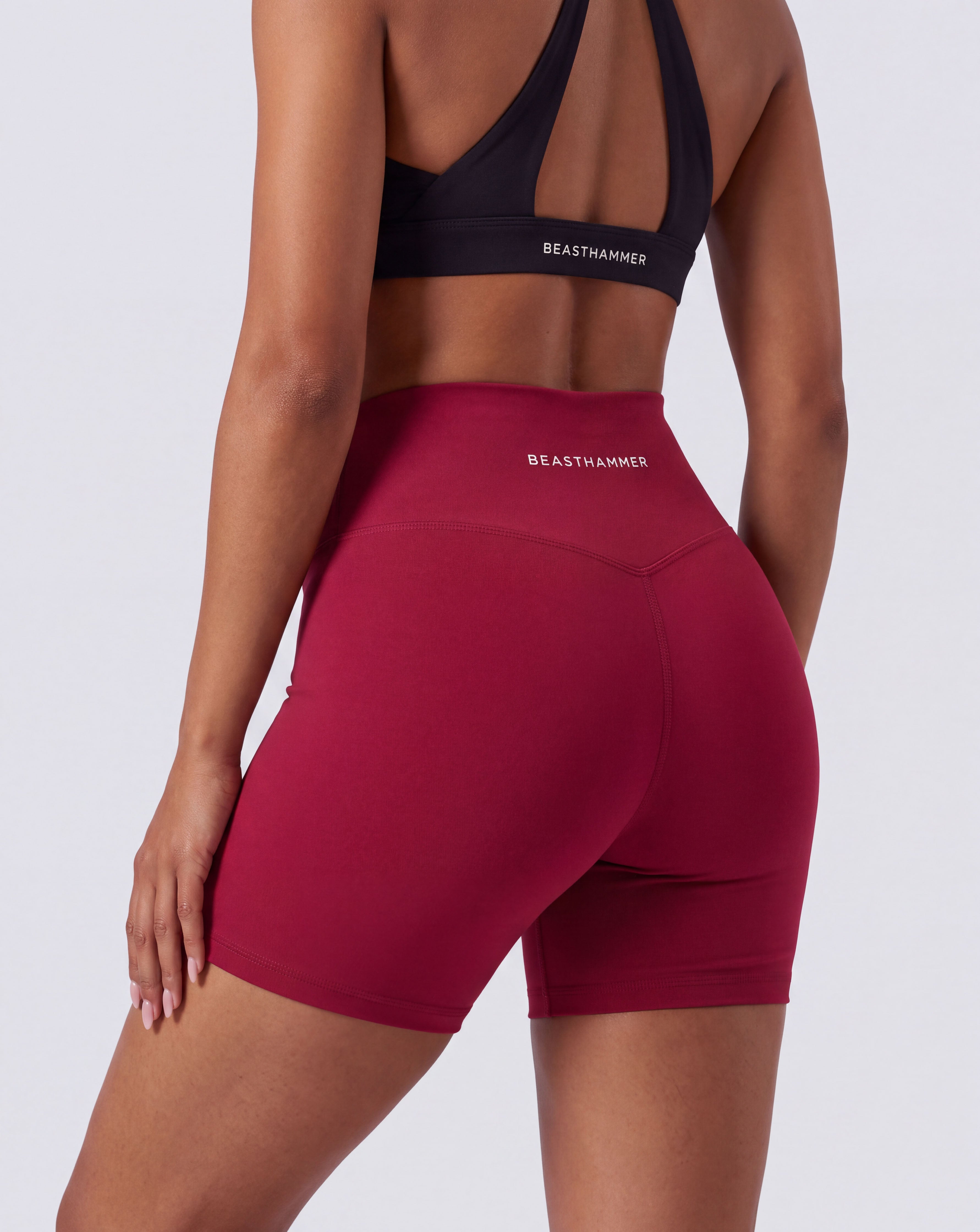BEASTHAMMER Form high rise shorts in red, worn back view