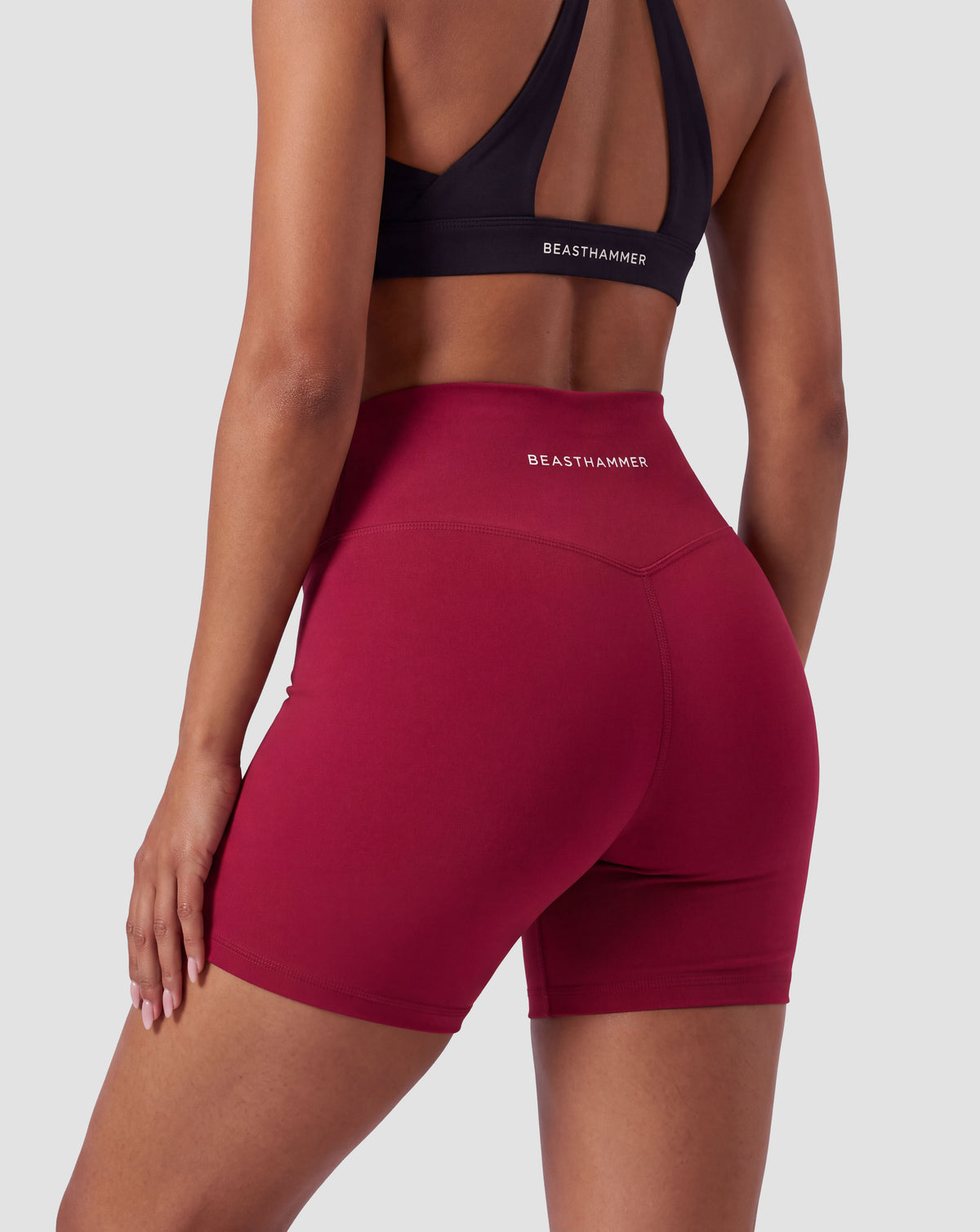 BEASTHAMMER Form high rise shorts in red, worn back view