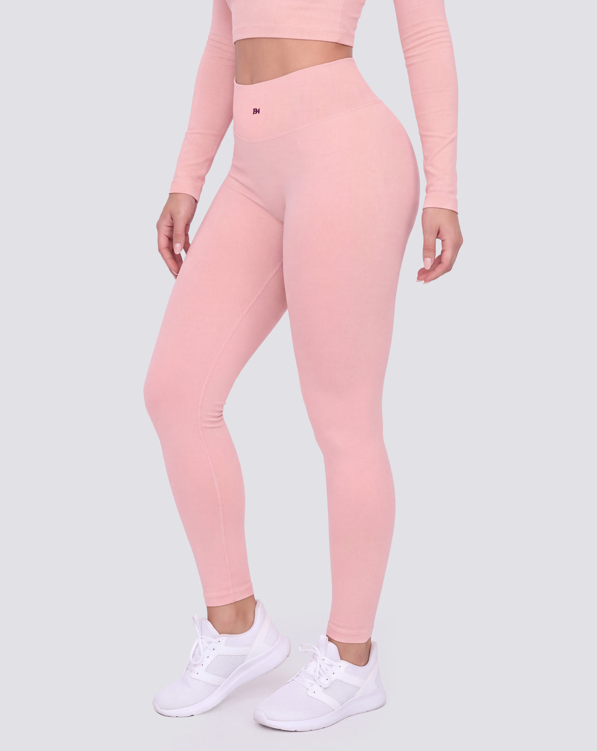 BEASTHAMMER Signature scrunch leggings in pink, worn front three-quarter view showing the high-rise waistband and ankle length