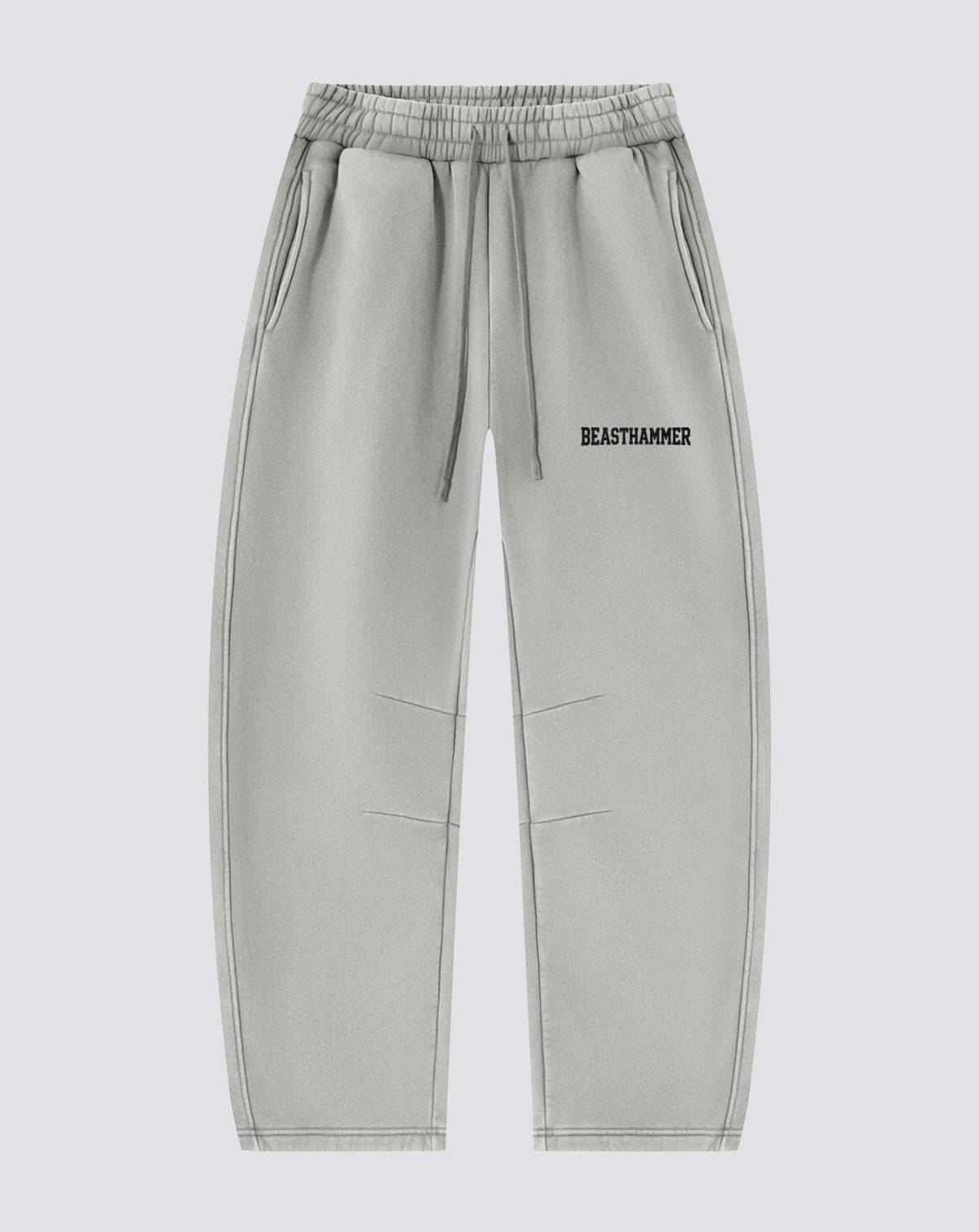 BEASTHAMMER Vintage Wash barrel leg joggers in washed grey, front view with logo on the thigh