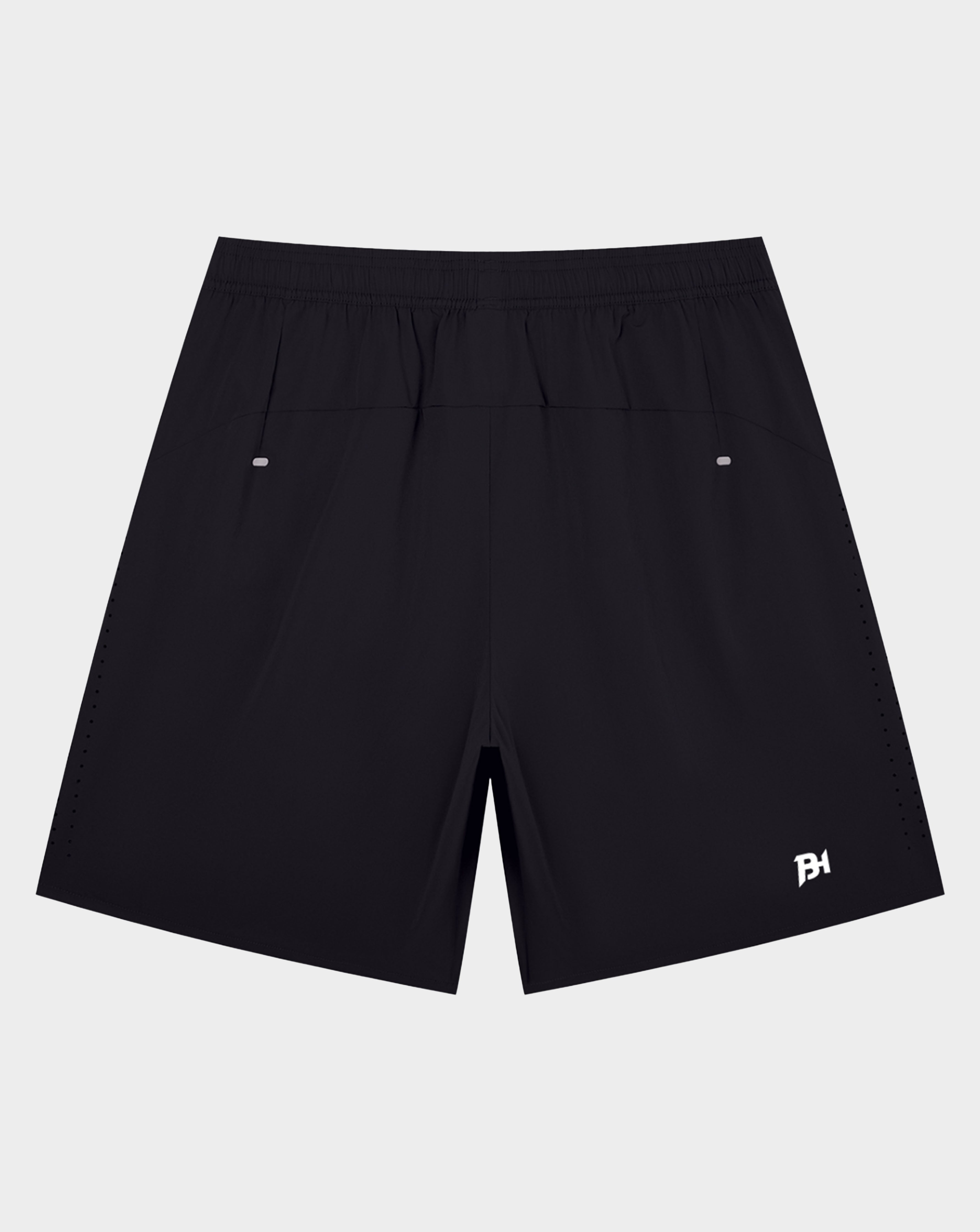White Canterbury athletic shorts with an elastic waistband and a black logo on the lower left leg, shown against a plain white background.