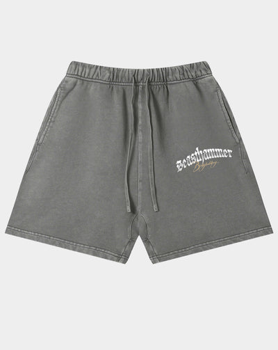 Gray washed sweatshorts with a white gothic 'Beasthammer' logo on the left thigh, featuring an elastic waistband and drawstring.