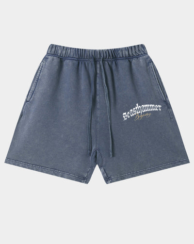 A pair of faded blue denim shorts with a drawstring waist and a white 'seashammer' logo printed on the left leg, shown against a light gray background.